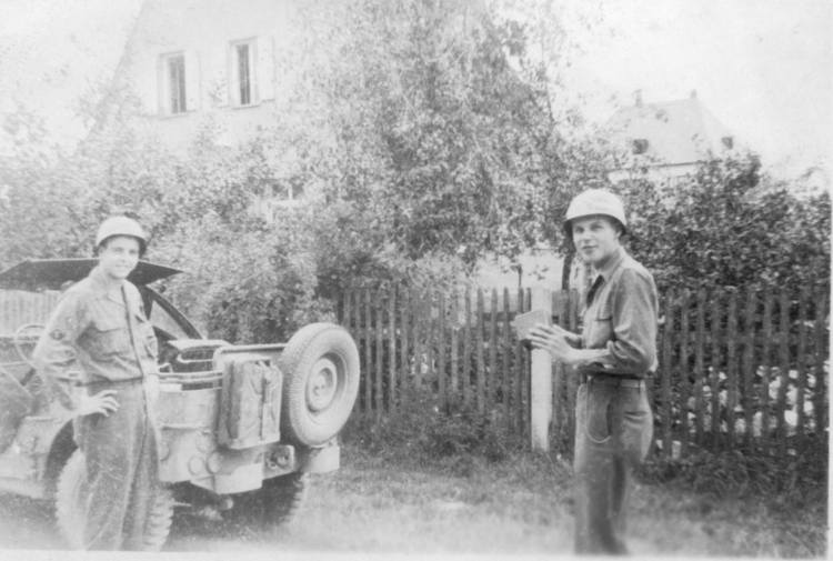 Robert Earl Bushweit (right) runs into his Detroit buddy, Percy, in a captured German town.